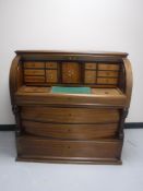 A late nineteenth century mahogany barrel fronted writing bureau