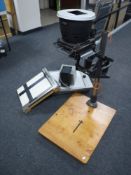 An Lietz Focomat enlarger on stand together with a transparency viewing box