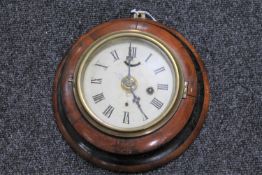 An early 20th century oak cased circular wall clock