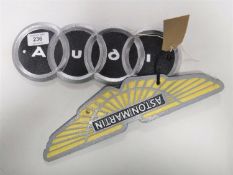 Two cast iron plaques - Aston Martin and Audi