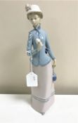 A Lladro figurine : Rose Lady, model 4999, height 31 cm, boxed.