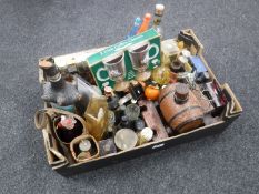 A box containing assorted alcohol decanters, miniatures,
