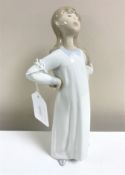 A Lladro figurine : Girl with Hands Akimbo, model 4872, height 20 cm, boxed.