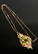 A superb quality antique 15ct gold peridot and ruby pendant with chain