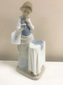 A Lladro figurine : Ironing Time, model 4981, height 26 cm, boxed.