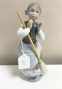 A Lladro figurine : A Clean Sweep, model 5025, height 24 cm, boxed.