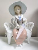 A Lladro figurine : Waiting in the Park, model 1374, height 26 cm, unboxed.