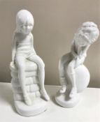 Two Spode plain white figurines designed by Pauline Shone : Jane and James, heights 21 cm and 19 cm.