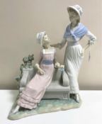 A Lladro figurine : Talking Ladies, model 5042, height 37 cm, boxed.