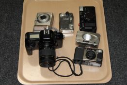 A group of cameras to include a Canon EOS 650, Pentex Espio 115G, Minolta Vectis 300,