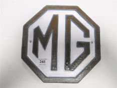 A cast iron MG car wall plaque