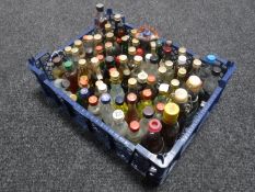 A basket containing approximately seventy-five alcohol miniatures