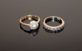 A white gold diamond half eternity ring and an 18ct gold diamond and opal cluster ring