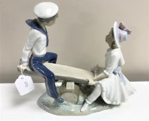 A Lladro figurine : Seesaw, model 1255, height 23 cm, unboxed.