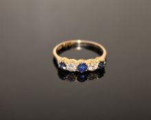 An 18ct gold five stone sapphire and diamond ring
