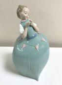 A Lladro figurine : Girl in Green Dress with Flower, model 5118, height 26 cm, boxed.