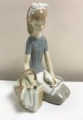 A Lladro figurine : Dove on the Lap, model 4909, height 20 cm, boxed.