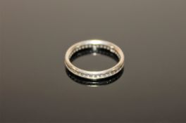 A platinum diamond eternity ring,