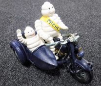 A cast iron figure - Michelin on motorcycle and side car
