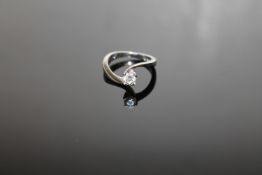 An 18ct white gold diamond solitaire ring, approximately 0.3ct, size J.