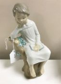 A Lladro figurine : Thinker Little Boy, model 4876, height 21 cm, boxed.