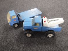 A tin plate Tonka recovery truck and a tin plate Tonka flat bed lorry