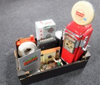 A box of novelty radios including a Levi's petrol pump radio, early Watch radio,