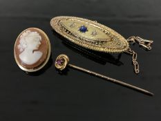 An antique 9ct gold brooch together with a cameo brooch, yellow metal pin and safety chain.