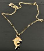 A 9ct gold dolphin pendant suspended upon a 9ct gold chain, 3.3g.