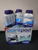 A Dulux paint pot system and four tubs of paint