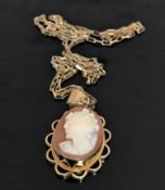 A 9ct gold cameo pendant suspended upon a 9ct gold chain