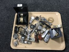 A tray of boxed Guess wristwatch, various modern wristwatches including Citizen, Gucci etc,