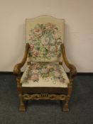 A continental carved oak tapestry seated armchair