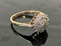 A 9ct gold diamond cluster ring, size L.