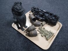 A tray of Chinese bronze figure of a foo dog, five graduated Eastern bells,