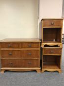 An inlaid yew wood four drawer chest and pair of matching bedside stands