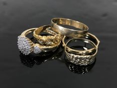 Three 9ct gold rings and two others indistinctly marked,