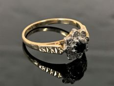 An 18ct gold diamond and sapphire cluster ring, size M.