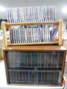 A pine CD rack and two CD racks containing classical CD's