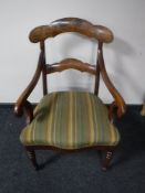 A late 19th century scroll arm armchair CONDITION REPORT: Minor veneer losses to