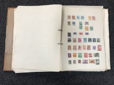 An album of mid 20th century Stamps of the World and six early 20th century novels