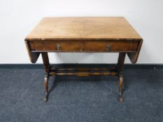 An antique walnut sofa table CONDITION REPORT: Veneer lifting and numerous minor