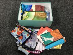A box of twenty silk scarves