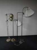 Four 20th century continental floor lamps