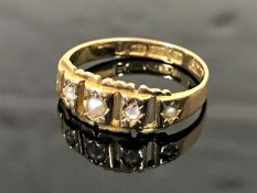 An antique 15ct gold ring set with old cut diamonds and seed pearls, size L.