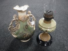 A Victorian oil lamp with glass chimney and a hand painted glass reservoir,