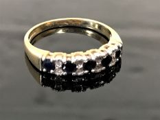 A 9ct gold diamond and sapphire half eternity ring, size N/O.