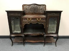 A Victorian mahogany chiffonier with a fret work panel