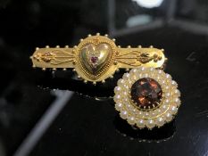 A 15ct gold diamond and garnet brooch,