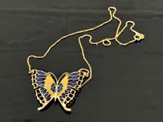 A yellow metal and enamel butterfly pendant suspended upon an 18ct gold chain, 9.5g gross.